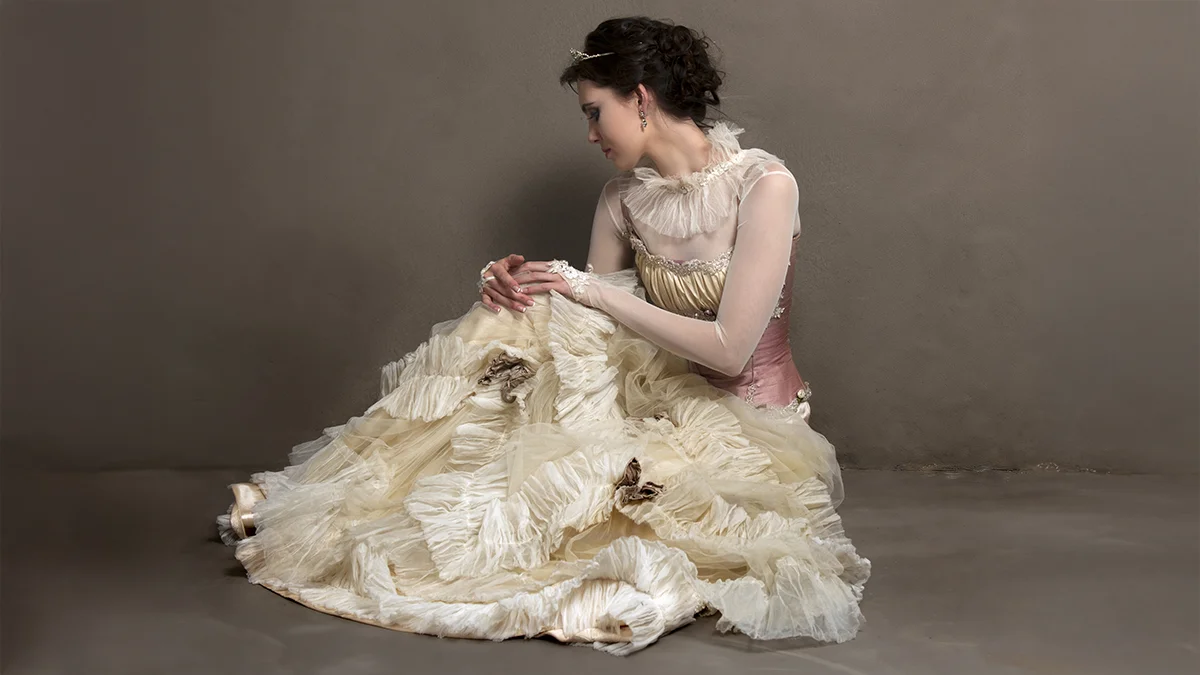 victorian beauty standards pale woman in white dress and corset