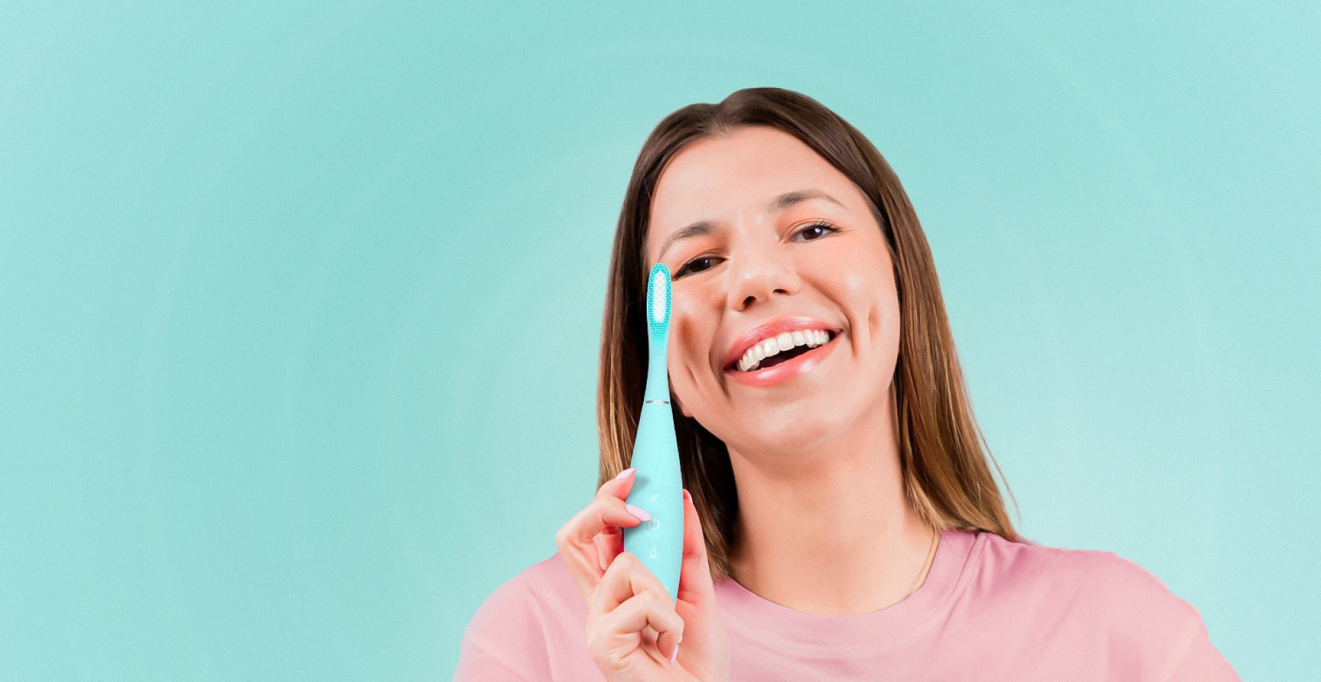 FOREO issa 4 sonic toothbrush held by a smiling model