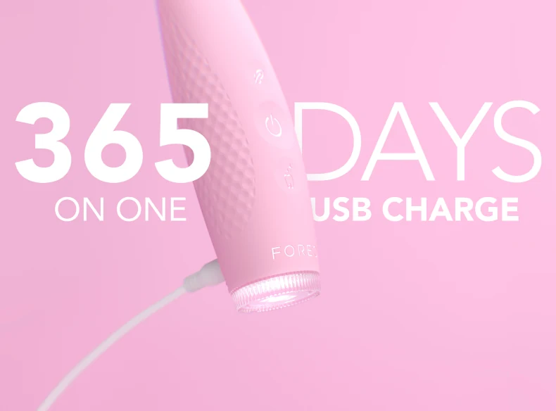 Pink FOREO issa 4 toothbrush connected to a USB cable with 365 days on one USB charge text
