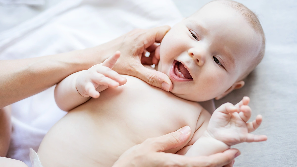 A cute baby with lower two teeth only