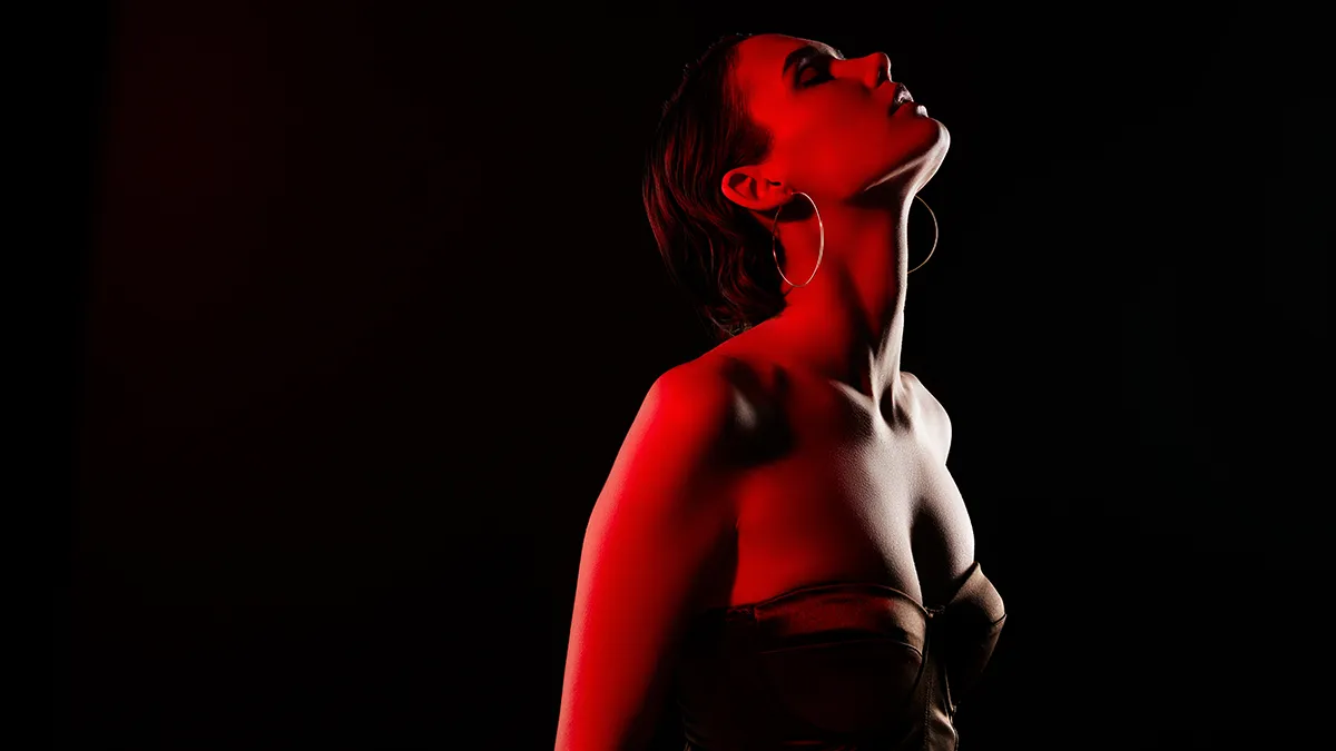A young woman getting red light therapy