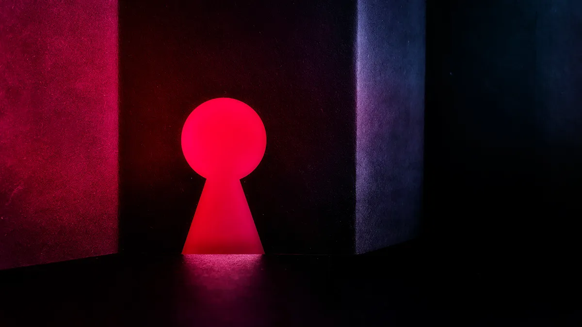 An interplay of light and dark, abstract space with a red light keyhole