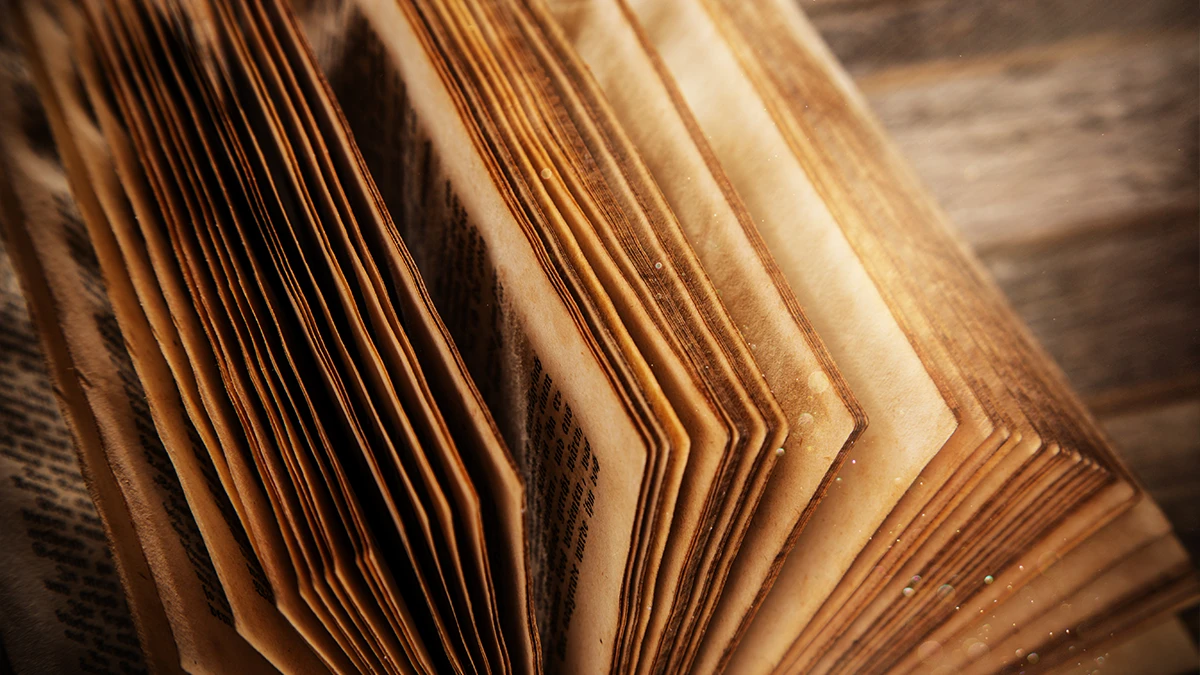Pages of an old book turning