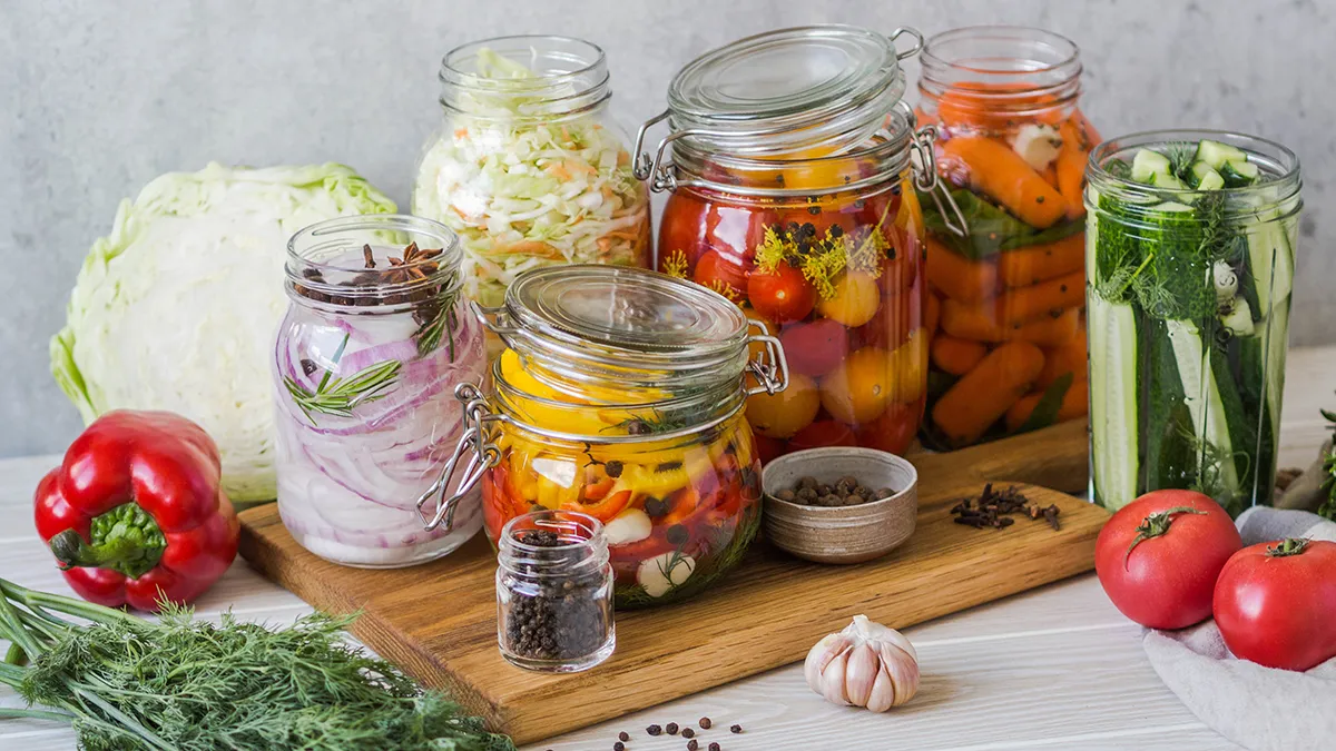 pickled and fermented foods for gut health in colorful jars
