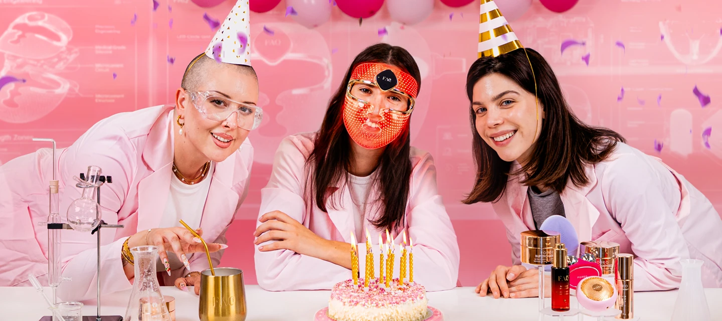 Girls celebrating FOREO birthday and skincare sale in pink labcoats