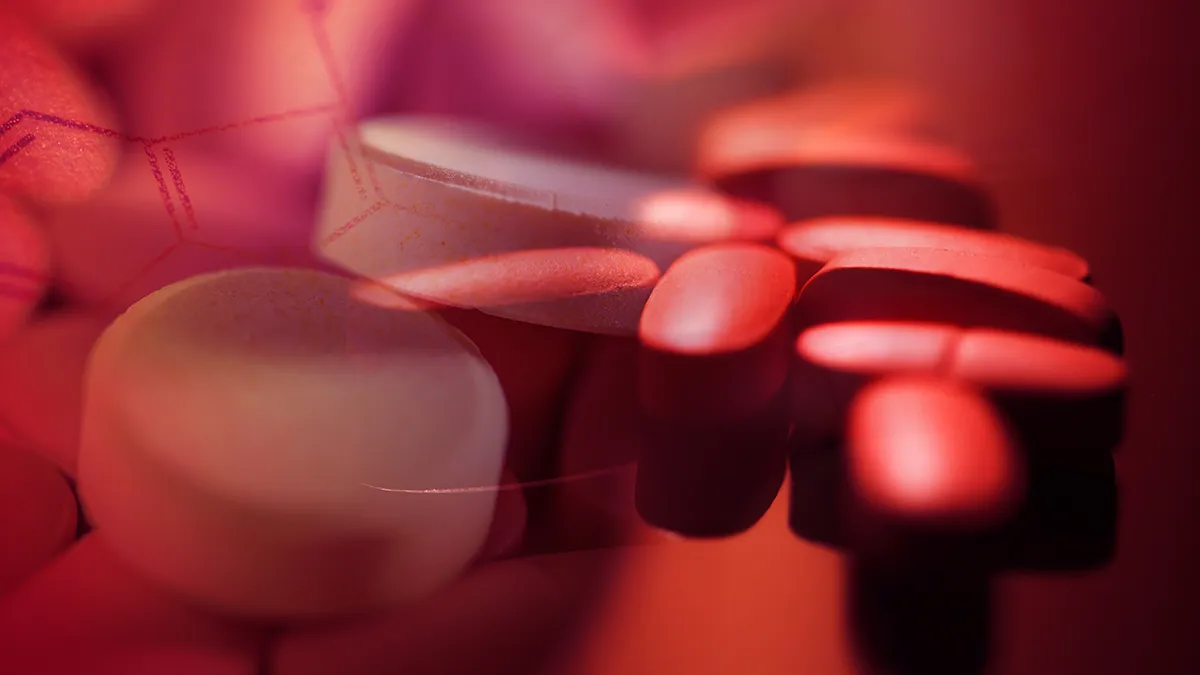 A bunch of pills on glass background