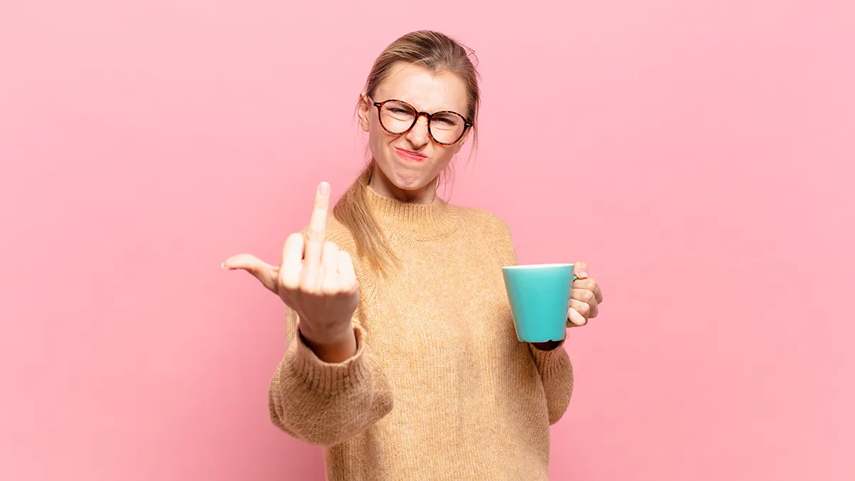 A woman flipping a middle finger due to perimenopause mood swings