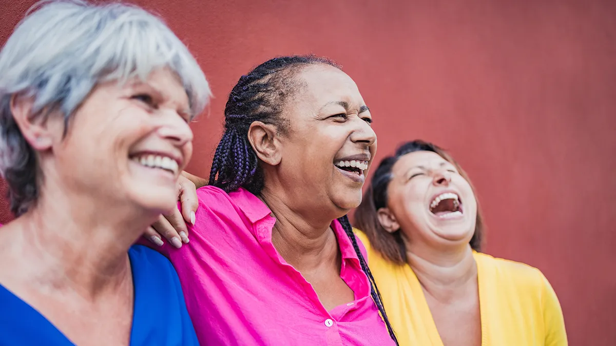 Women in menopause and perimenopause laughing together
