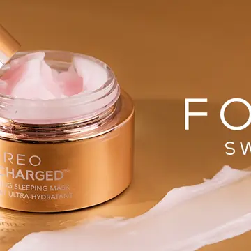 FOREO hydrating skincare in a gold jar on a caramel background