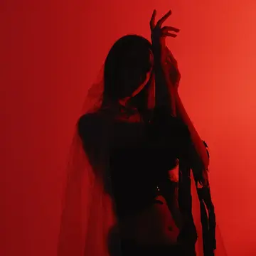 A woman dancing in red lights