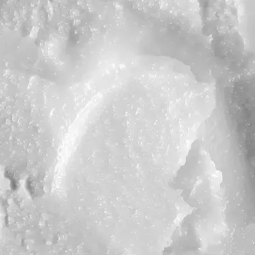 The white landscape of a closeup texture of coconut oil