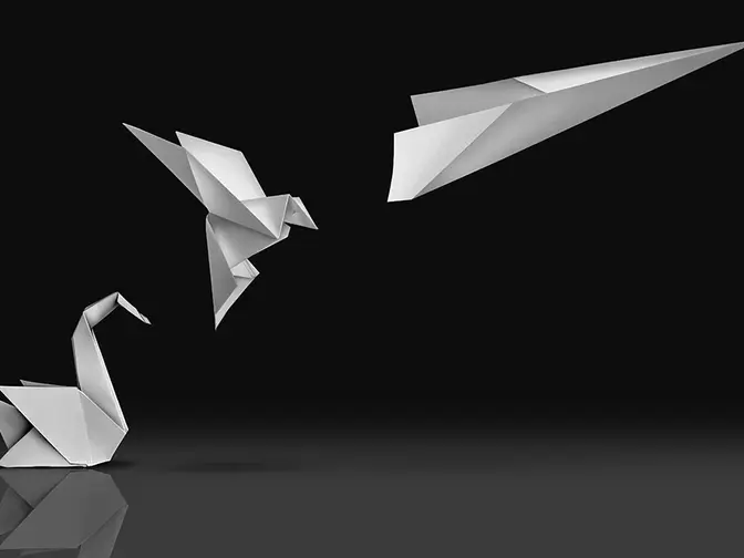 Crumpled paper on black background, transforms into a bird and then into a paper plane (no Superman, unfortunately)