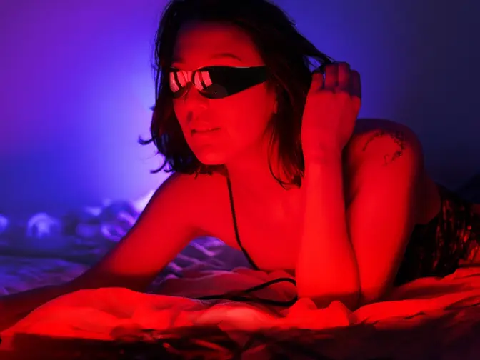 Woman using FAQ Collection dual red light panel