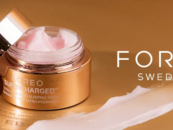 FOREO hydrating skincare in a gold jar on a caramel background