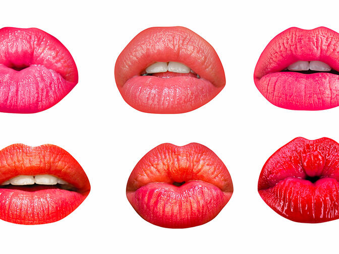 Set of female lips with lipsticks in different shades on white isolated background.