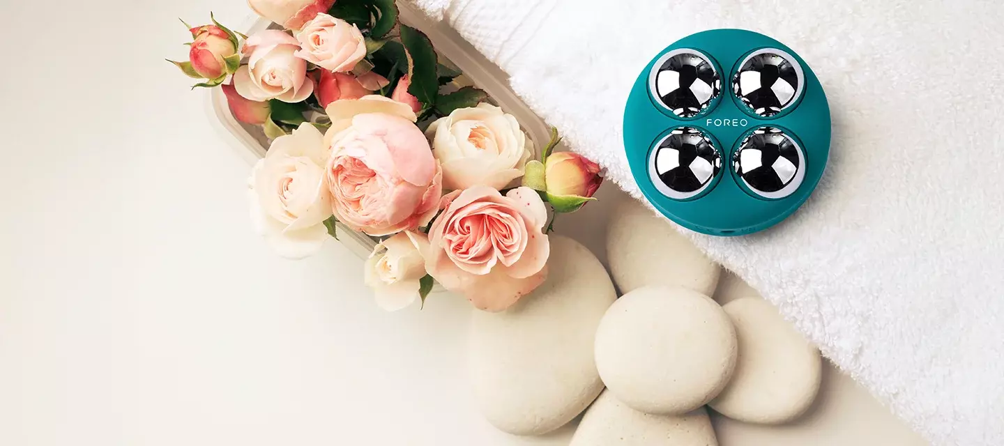 BEAR 2 body microcurrent device for body BEAR 2 body with gorgeous blooming flowers in a clean beige lifestyle aesthetics