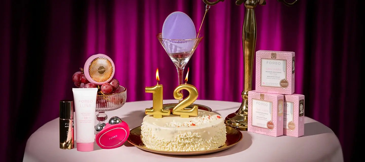 FOREO Bday deals 2025 FOREO devices and cosmetics around a birthday cake with the candles showing the number 12