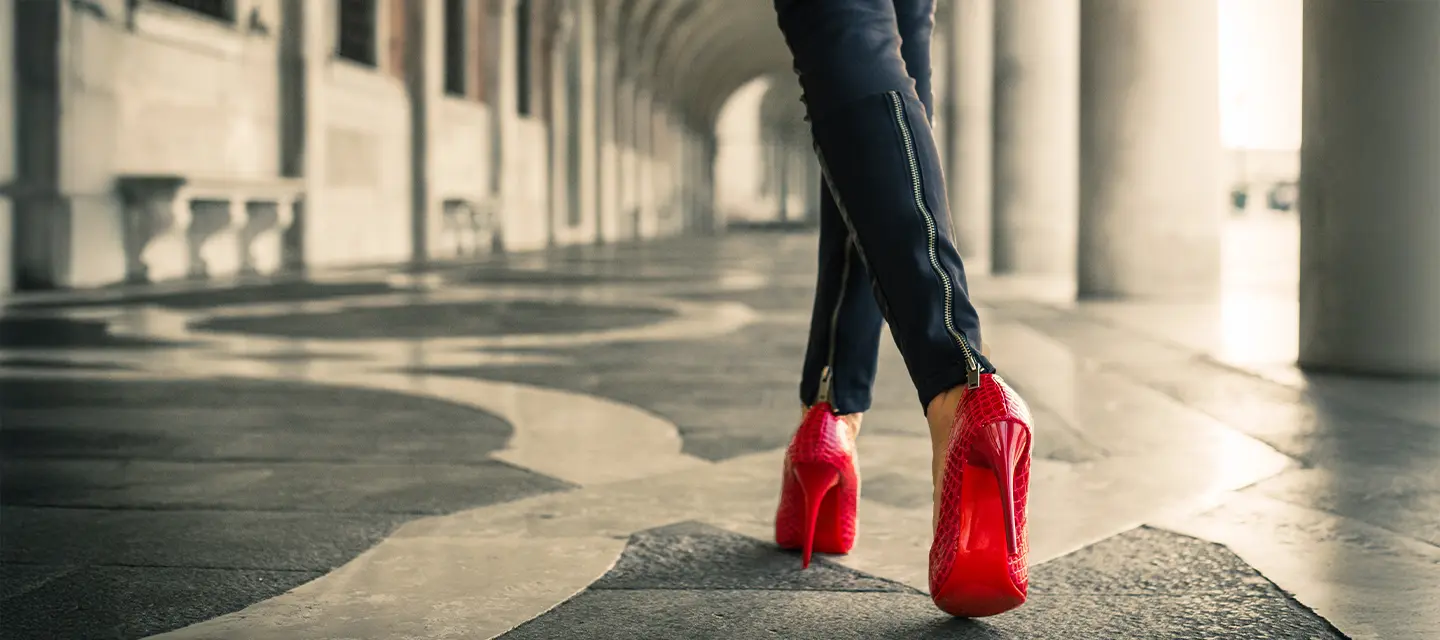 Wizard of Oz red shoes A modern woman in red high heals walking away from us symbolising The Wizard of Oz Dorothy and her red shoes