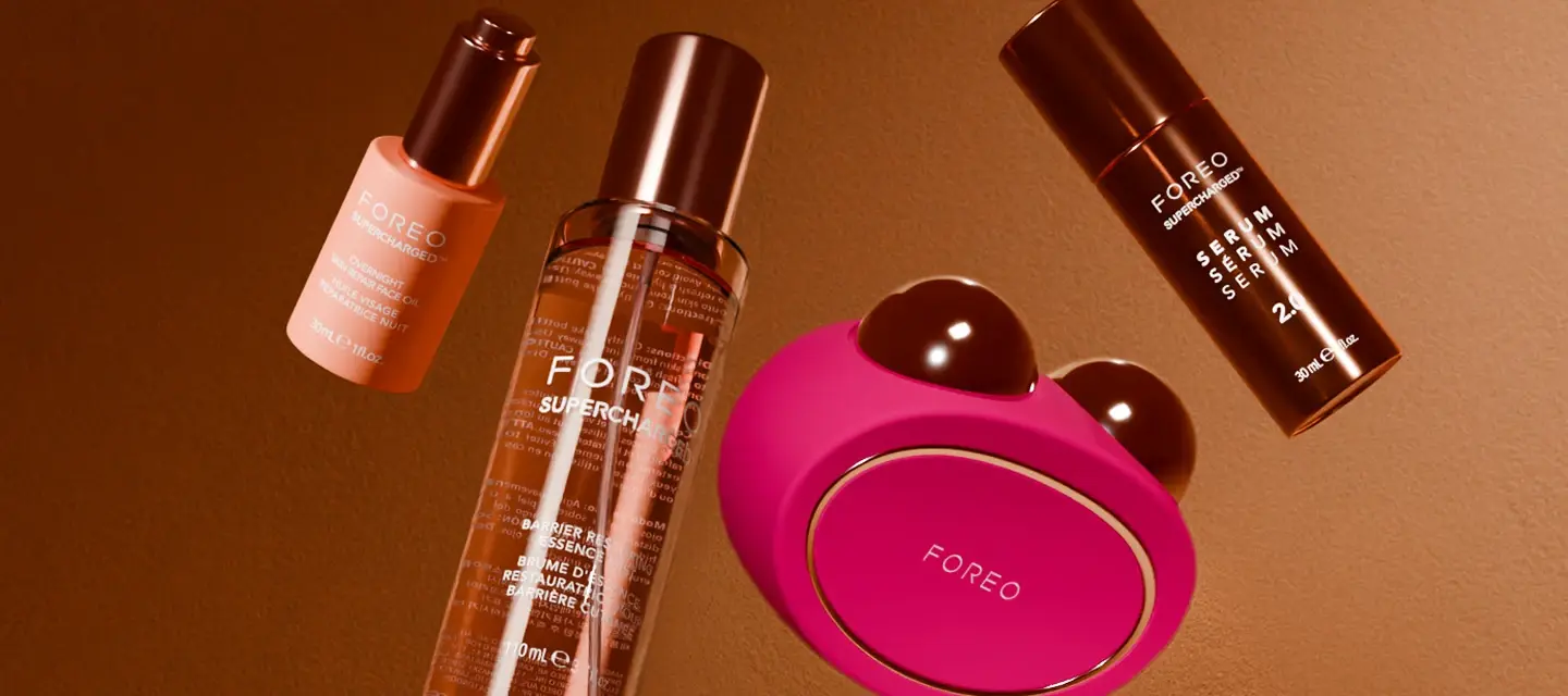 FOREO products floating on a gold background Back To Work FOREO Deals