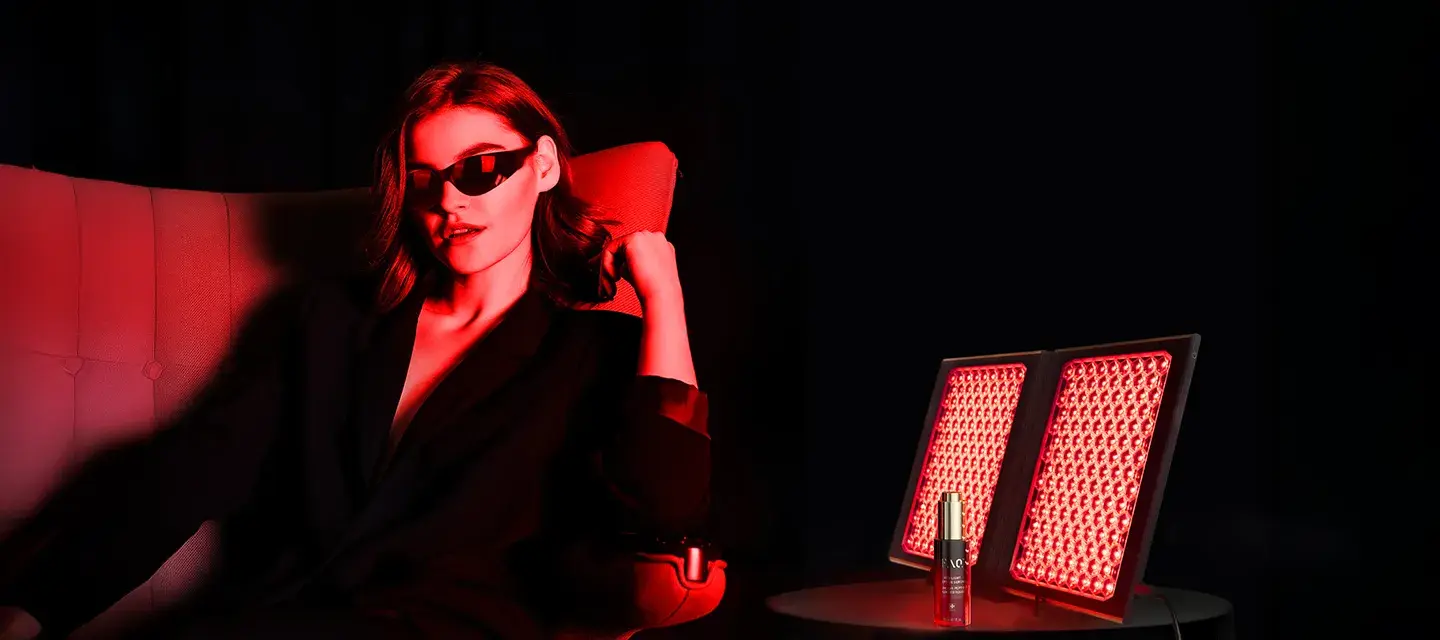FAQ dual LED light panel A modern woman in a dark room using FAQ dual LED light panel