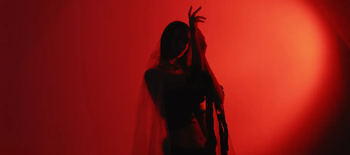 A woman dancing in red lights