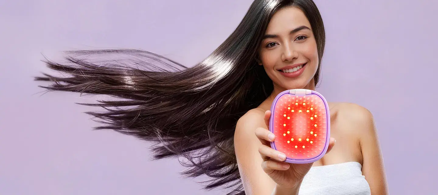 A woman with glossy hair in movement showing FLIP plus LED light hairbrush