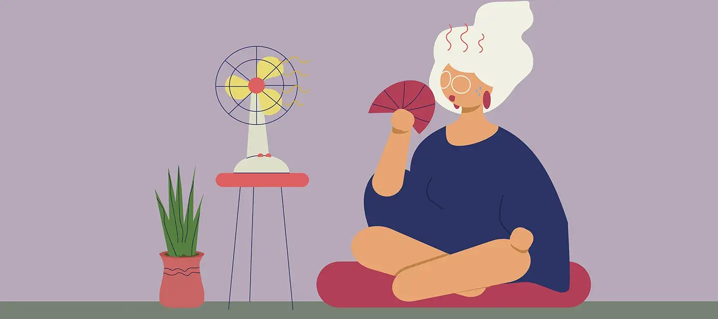 A cartoon of a menopausal woman having a hot flash and sitting in front of a fan
