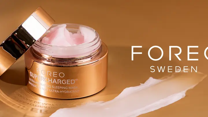 FOREO hydrating skincare in a gold jar on a caramel background