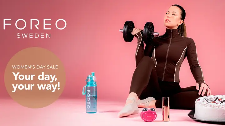  A beautiful young woman in sporty clothes excercising with a cake next to her 