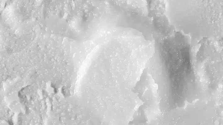 The white landscape of a closeup texture of coconut oil