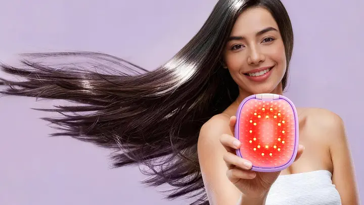 A woman with glossy hair in movement showing FLIP plus LED light hairbrush